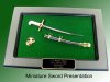 Miniature sword presentation plaque