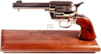 Western style Colt Peacemaker 1873 on wood