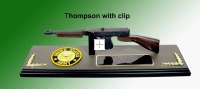 Thompson sub machine gun on wood plaque base
