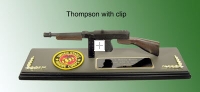 Thompson sub machine gun on wood plaque base