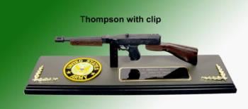 Thompson sub machine gun on wood plaque base